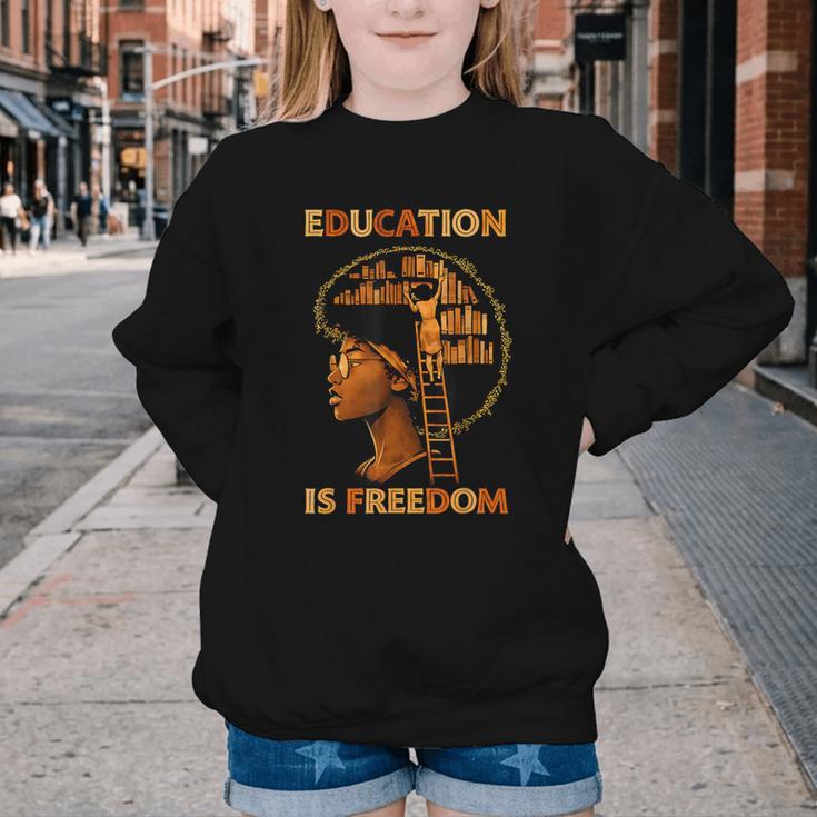 Education Is Freedom Teacher Book Black History Month Youth Crewneck Sweatshirt