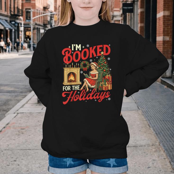 I'm Booked For The Holidays Christmas Reading Bookworm Xmas Youth Crewneck Sweatshirt I'm Booked For The Holidays Christmas Reading Bookworm Xmas Youth Crewneck Sweatshirt