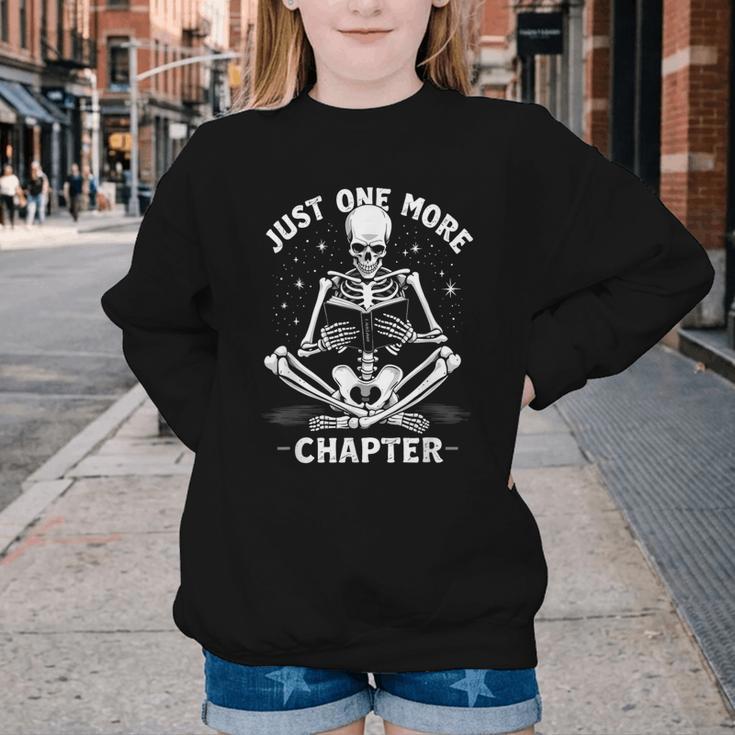 Just One More Chapter Skeleton Reading Bookworm Youth Crewneck Sweatshirt Just One More Chapter Skeleton Reading Bookworm Youth Crewneck Sweatshirt