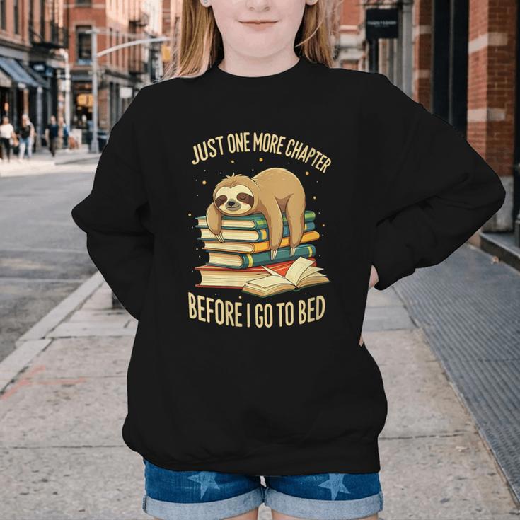 Just One More Chapter Sloth Sleeping On Books Reading Youth Crewneck Sweatshirt