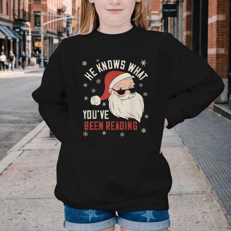 He Knows What You'Ve Been Reading Book Lover Women Santa Youth Crewneck Sweatshirt