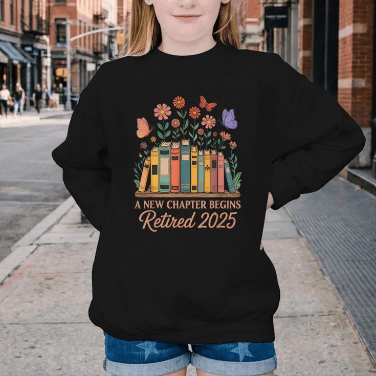 A New Chapter Begins Retired 2025 Books Flowers Youth Crewneck Sweatshirt