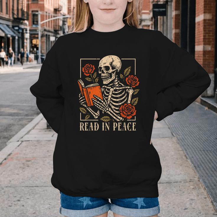 Read In Peace Skeleton Reading Book Halloween Teacher Youth Crewneck Sweatshirt