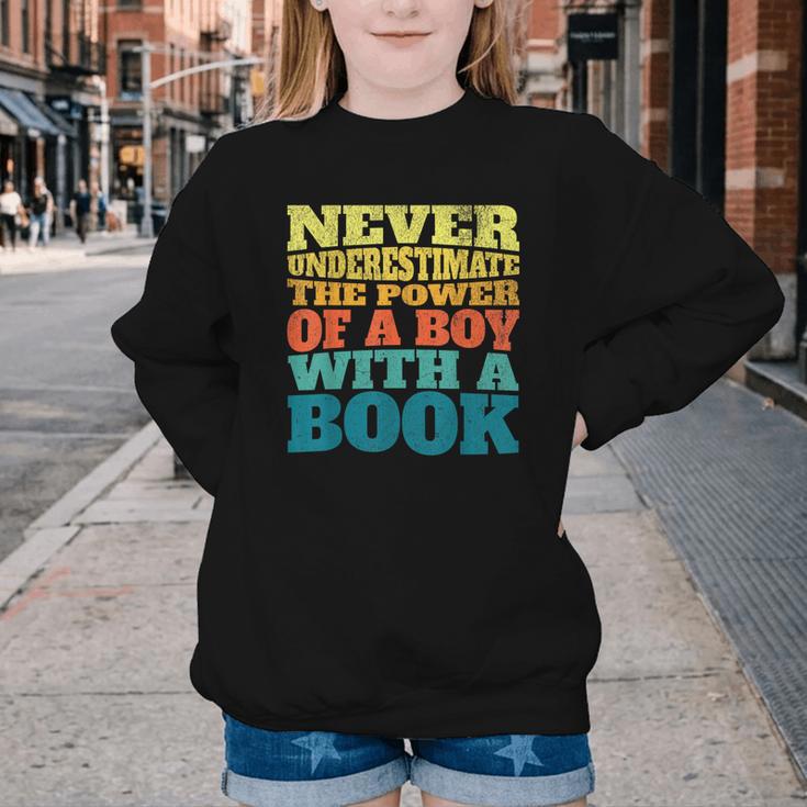 Retro Never Underestimate The Power Of a Boy With a Book Youth Crewneck Sweatshirt