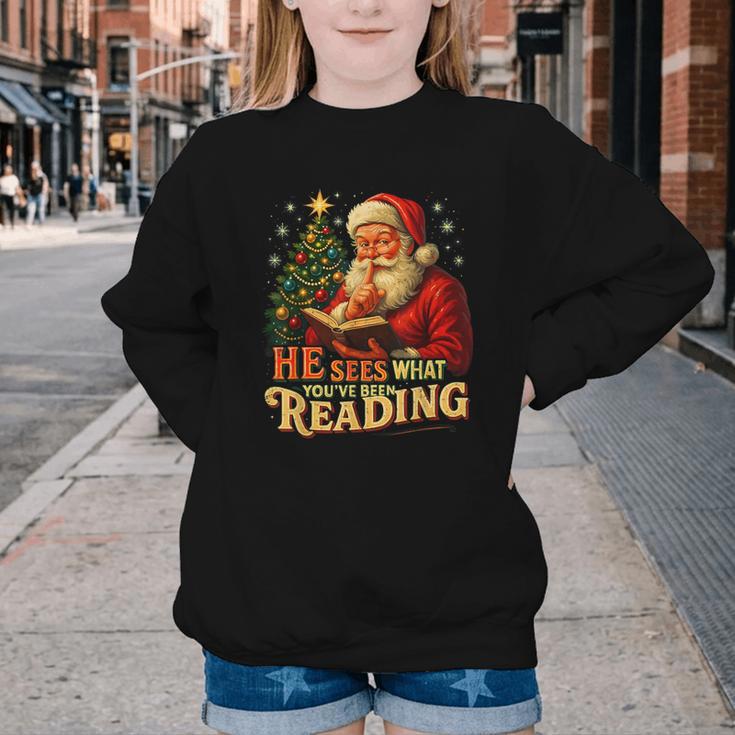 He Sees What You’Ve Been Reading Santa Book Lover Christmas Youth Crewneck Sweatshirt