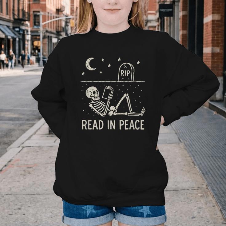 Skeleton Read In Peace Halloween Book Graphic Bookish Youth Crewneck Sweatshirt Skeleton Read In Peace Halloween Book Graphic Bookish Youth Crewneck Sweatshirt