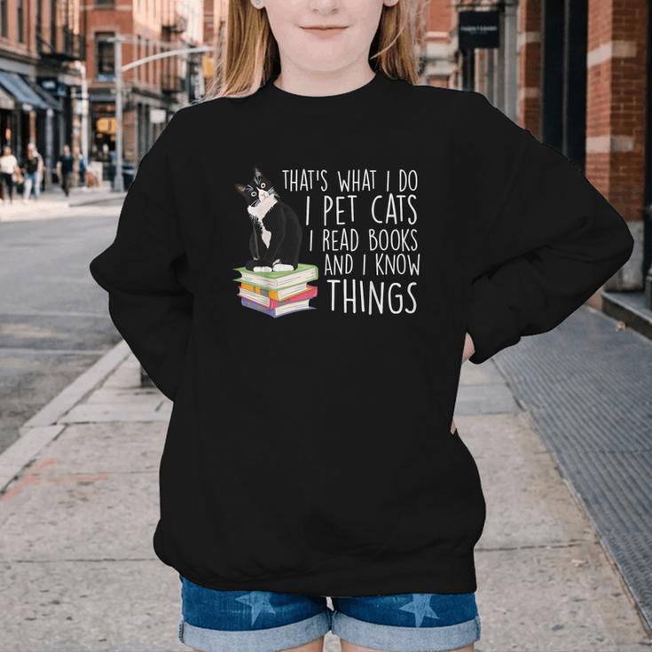 That's What I Do I Pet Cat I Read Books Tuxedo Cat Bookworm Youth Crewneck Sweatshirt That's What I Do I Pet Cat I Read Books Tuxedo Cat Bookworm Youth Crewneck Sweatshirt