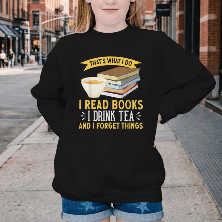 That’s What I Do Read Books I Drink Tea And I Forget Things Youth Crewneck Sweatshirt That’s What I Do Read Books I Drink Tea And I Forget Things Youth Crewneck Sweatshirt