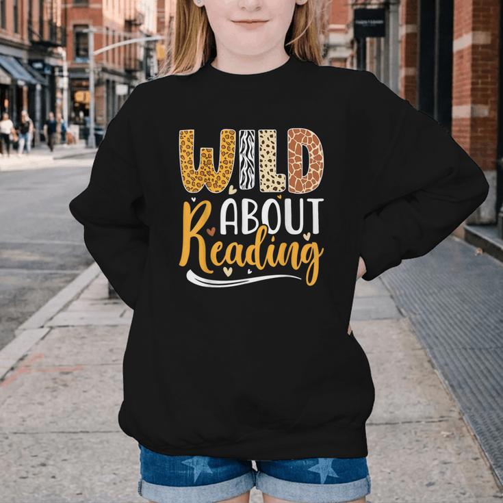 Wild About Reading Lover Bookworm Library Teacher Zoo Animal Youth Crewneck Sweatshirt Wild About Reading Lover Bookworm Library Teacher Zoo Animal Youth Crewneck Sweatshirt