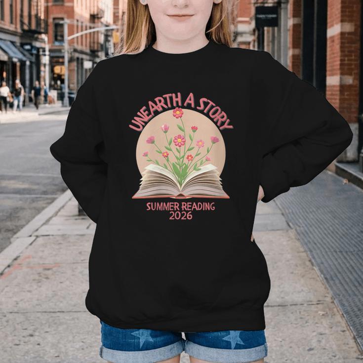 Women's Unearth a Story 2026 Summer Reading Program Flowers Book Youth Crewneck Sweatshirt Women's Unearth a Story 2026 Summer Reading Program Flowers Book Youth Crewneck Sweatshirt