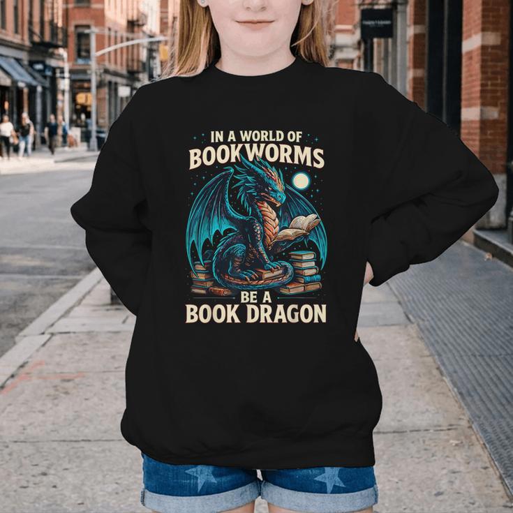 In a World Of Bookworms Be a Book Dragon Reading Youth Crewneck Sweatshirt
