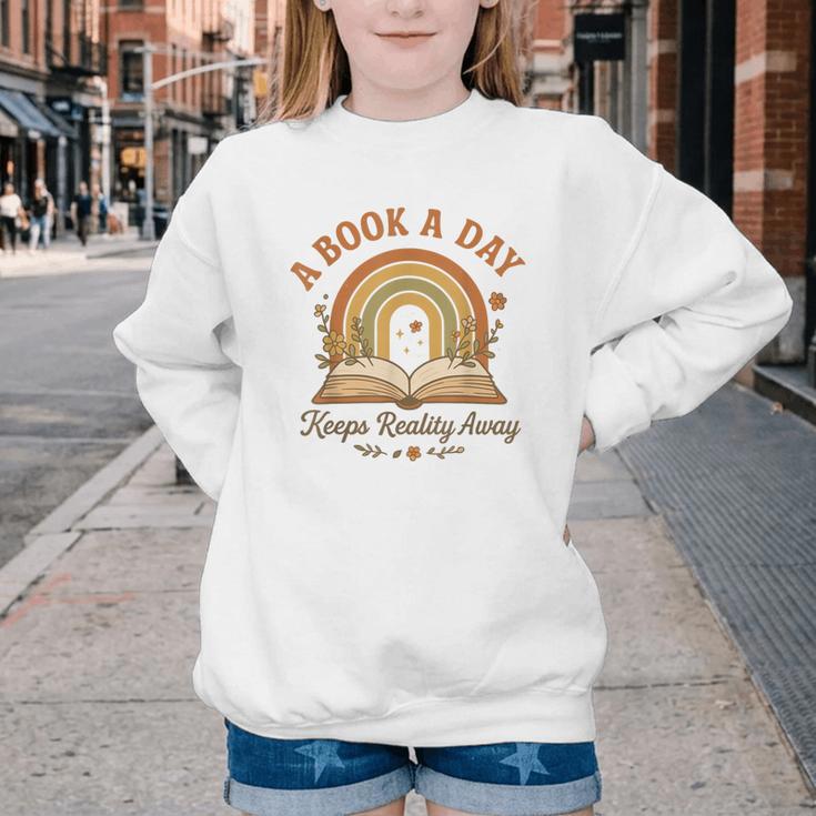 A Book A Day Keeps Reality Away Reading Youth Crewneck Sweatshirt A Book A Day Keeps Reality Away Reading Youth Crewneck Sweatshirt