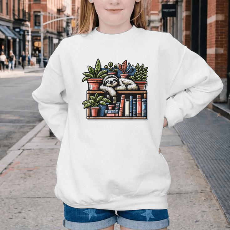 Cosy Sloth In Bookshelf With Plants Youth Crewneck Sweatshirt Cosy Sloth In Bookshelf With Plants Youth Crewneck Sweatshirt