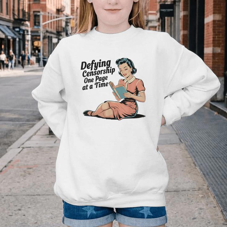 Defying Censorship One Page At a Time Read Banned Books Youth Crewneck Sweatshirt Defying Censorship One Page At a Time Read Banned Books Youth Crewneck Sweatshirt