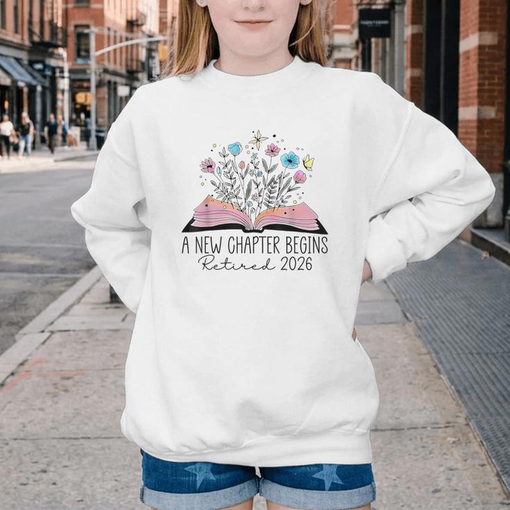 Floral Book A New Chapter Begins Retired 2026 Retirement Youth Crewneck Sweatshirt Floral Book A New Chapter Begins Retired 2026 Retirement Youth Crewneck Sweatshirt