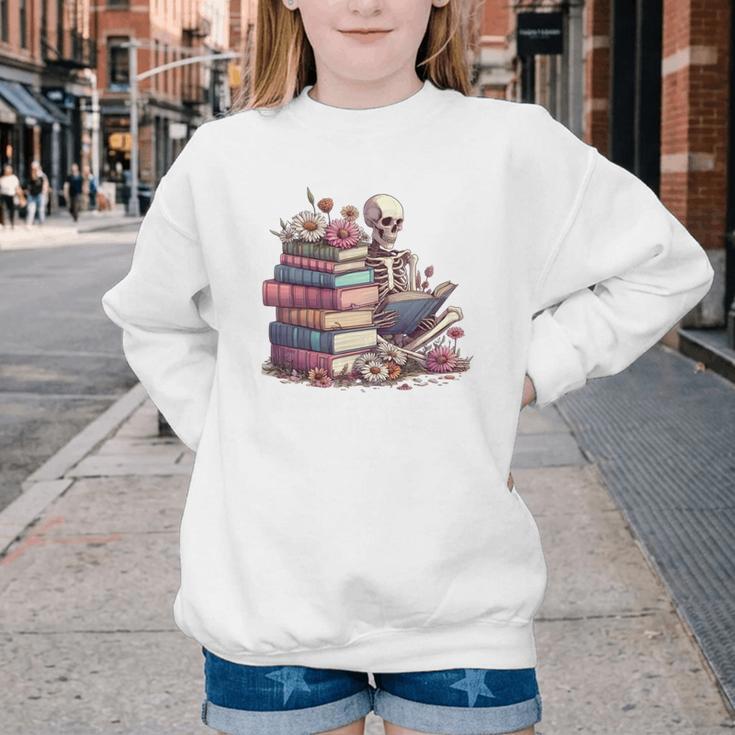 Reading A Book Per Day Keeps Reality Away Skeleton Books Youth Crewneck Sweatshirt