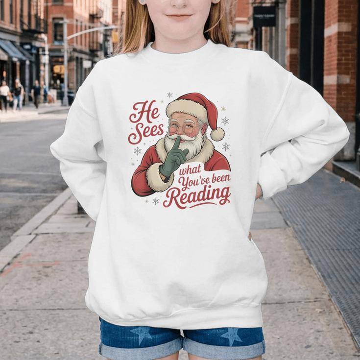 He Sees What You'Ve Been Reading Bookish Christmas Humor Youth Crewneck Sweatshirt He Sees What You'Ve Been Reading Bookish Christmas Humor Youth Crewneck Sweatshirt