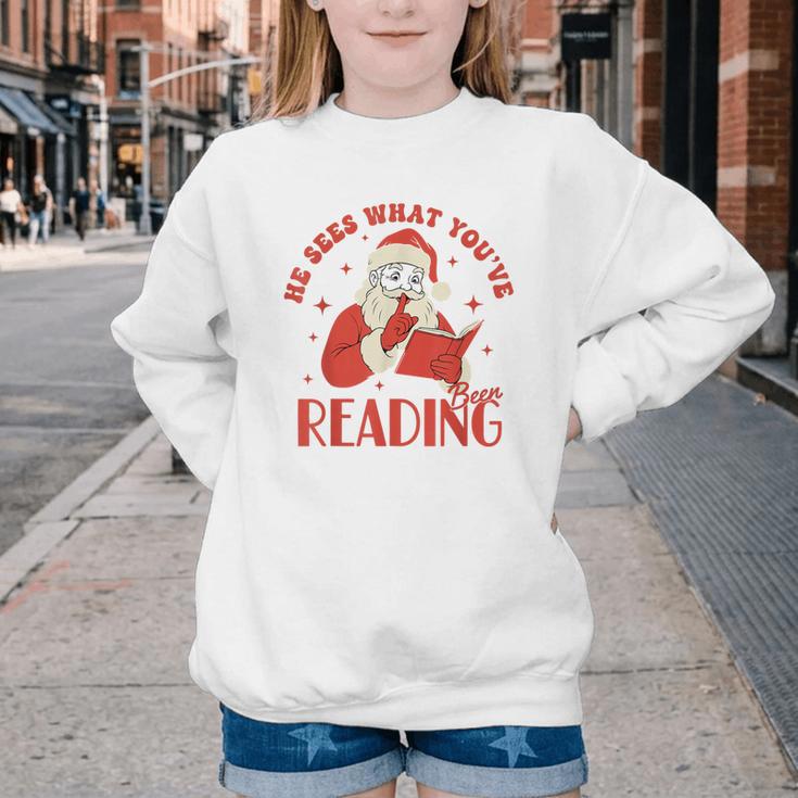 He Sees What You'Ve Been Reading Santa Book Youth Crewneck Sweatshirt