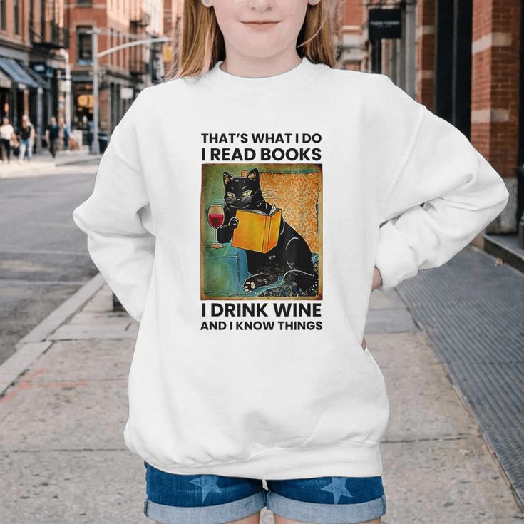 That's What I Do I Read Books I Drink Wine And I Know Things Youth Crewneck Sweatshirt That's What I Do I Read Books I Drink Wine And I Know Things Youth Crewneck Sweatshirt