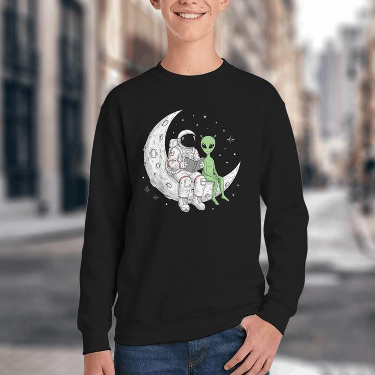 Astronaut Reading Book To Alien Moon Space Book Lover Men Youth Crewneck Sweatshirt