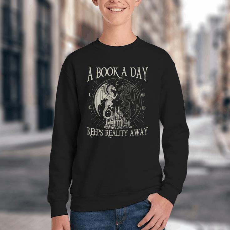 Fantasy Book Club Dragon Reader Book A Day Keep Reality Away Youth Crewneck Sweatshirt
