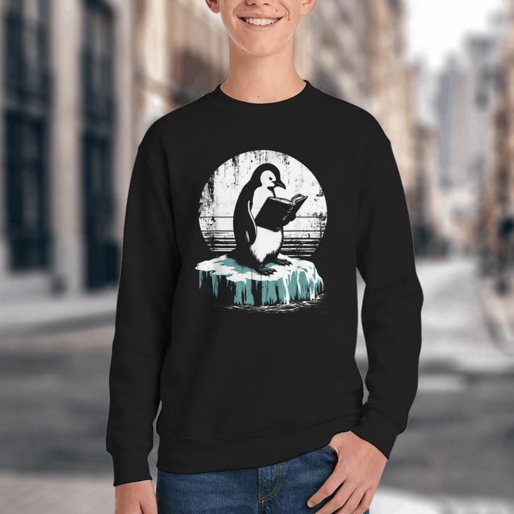 Penguin Reading A Book Vintage Graphic Bookworm Lover Youth Crewneck Sweatshirt Penguin Reading A Book Vintage Graphic Bookworm Lover Youth Crewneck Sweatshirt