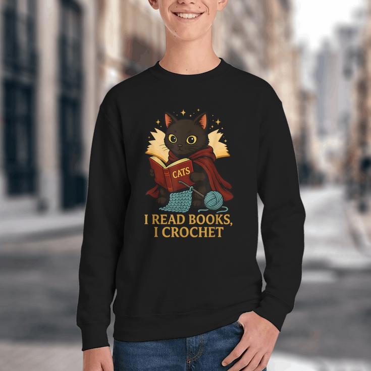 Wizard Cat Reading a Book While Crocheting Youth Crewneck Sweatshirt
