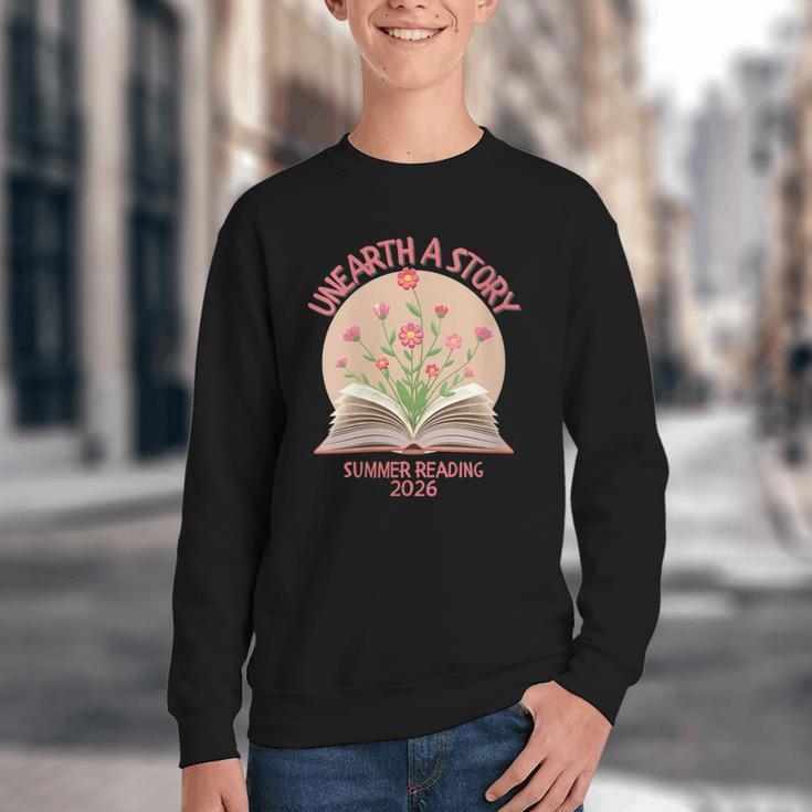 Women's Unearth a Story 2026 Summer Reading Program Flowers Book Youth Crewneck Sweatshirt Women's Unearth a Story 2026 Summer Reading Program Flowers Book Youth Crewneck Sweatshirt