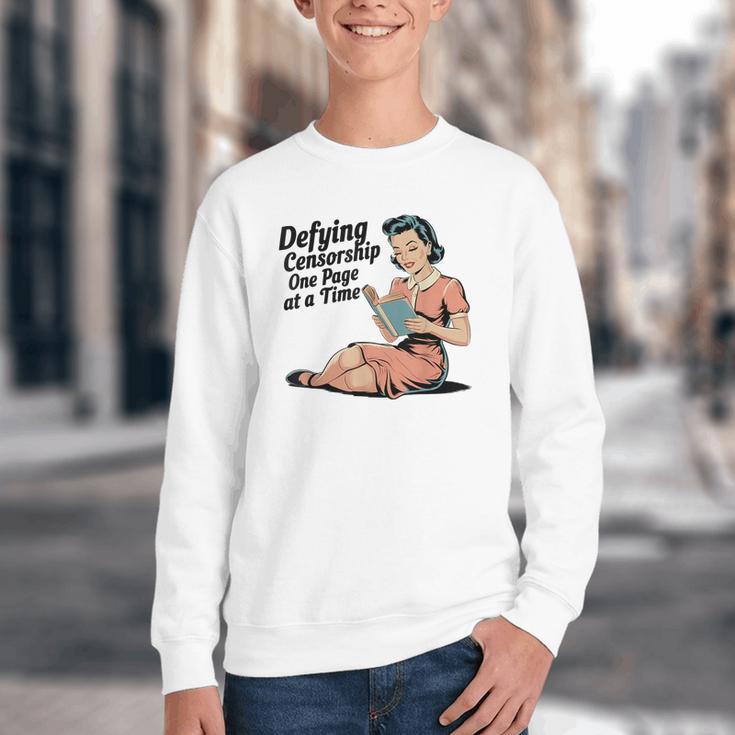 Defying Censorship One Page At a Time Read Banned Books Youth Crewneck Sweatshirt Defying Censorship One Page At a Time Read Banned Books Youth Crewneck Sweatshirt