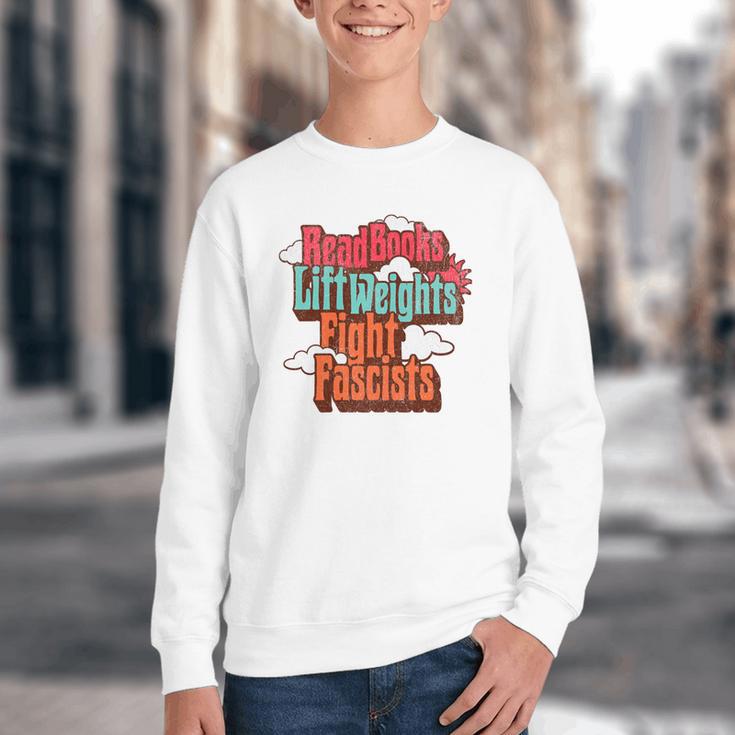 Read Books Lift Weights Fight Fascists Reading No Kings Premium Tri-Blend Youth Crewneck Sweatshirt