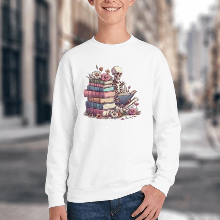 Reading A Book Per Day Keeps Reality Away Skeleton Books Youth Crewneck Sweatshirt