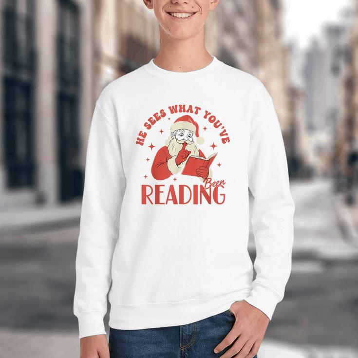 He Sees What You'Ve Been Reading Santa Book Youth Crewneck Sweatshirt