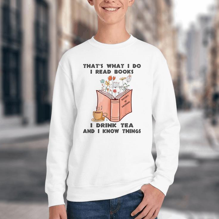 That's What I Do I Read Books I Drink Tea And I Know Things Youth Crewneck Sweatshirt