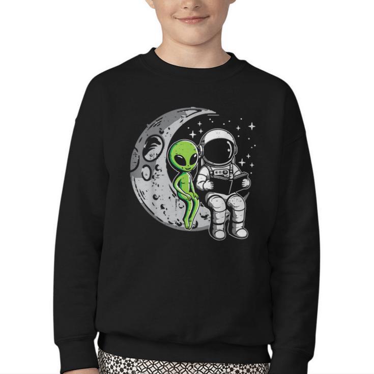 Astronaut Reading Book To Alien Moon Space Women Kids Men Youth Crewneck Sweatshirt
