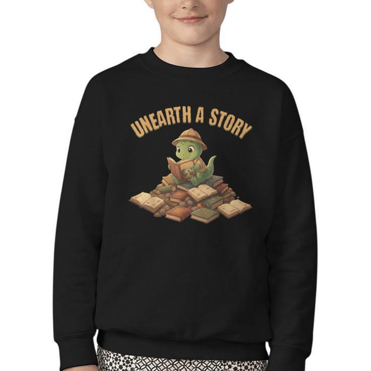 Unearth a Story Dinosaur Reading Books Summer 2026 Youth Crewneck Sweatshirt