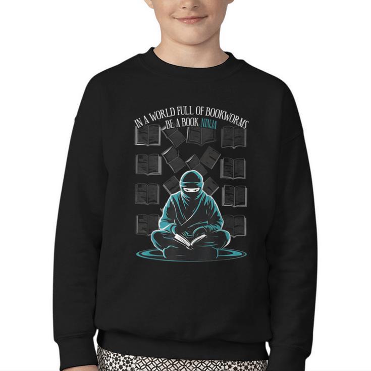 In A World Full Of Bookworms Be A Book Ninja Reading Reader Youth Crewneck Sweatshirt