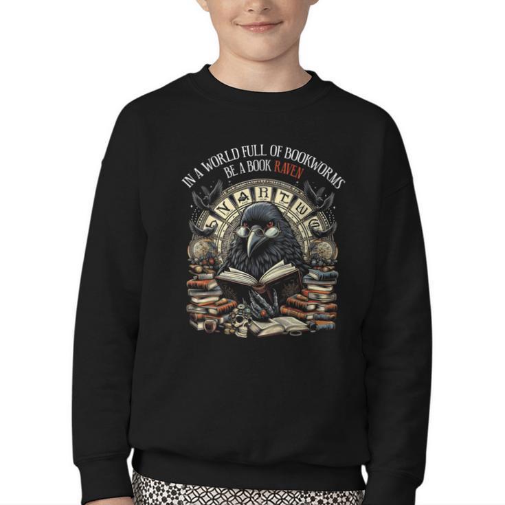 In A World Full Of Bookworms Be A Book Raven Reader Reading Youth Crewneck Sweatshirt