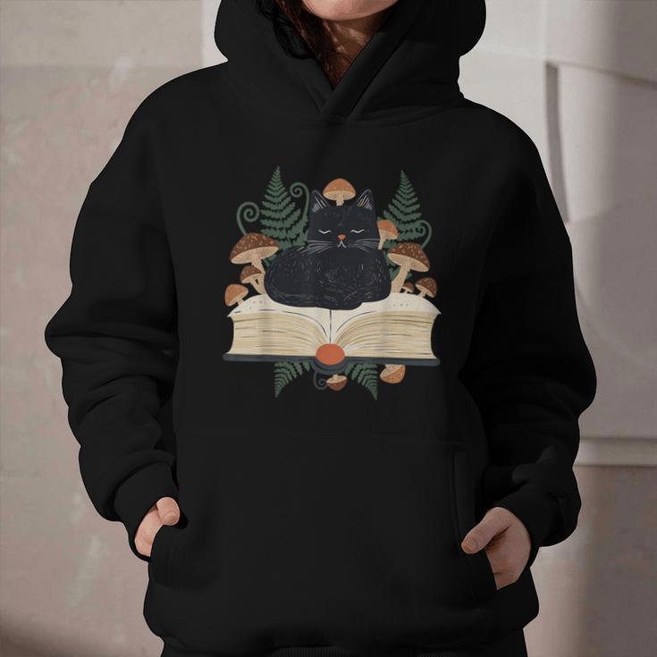 Cat On Open Book Mushrooms Ferns Dark Academia Graphic Youth Hoodie Cat On Open Book Mushrooms Ferns Dark Academia Graphic Youth Hoodie