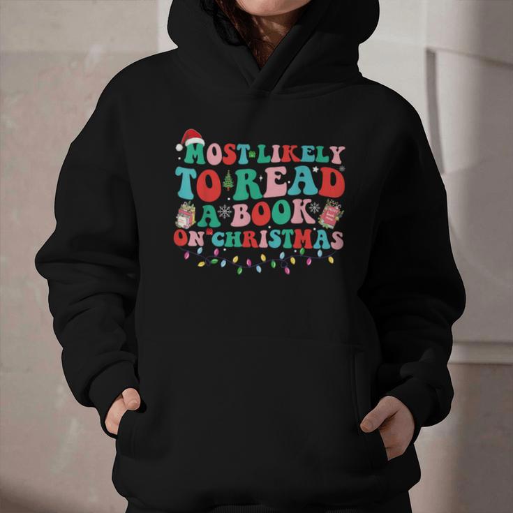 Groovy Christmas Most Likely To Read A Book On Christmas Graphic Youth Hoodie
