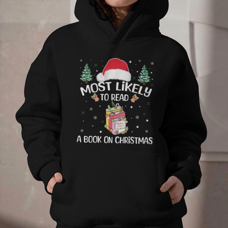 Most Likely To Read A Book On Christmas Love Reading Books Graphic Youth Hoodie Most Likely To Read A Book On Christmas Love Reading Books Graphic Youth Hoodie