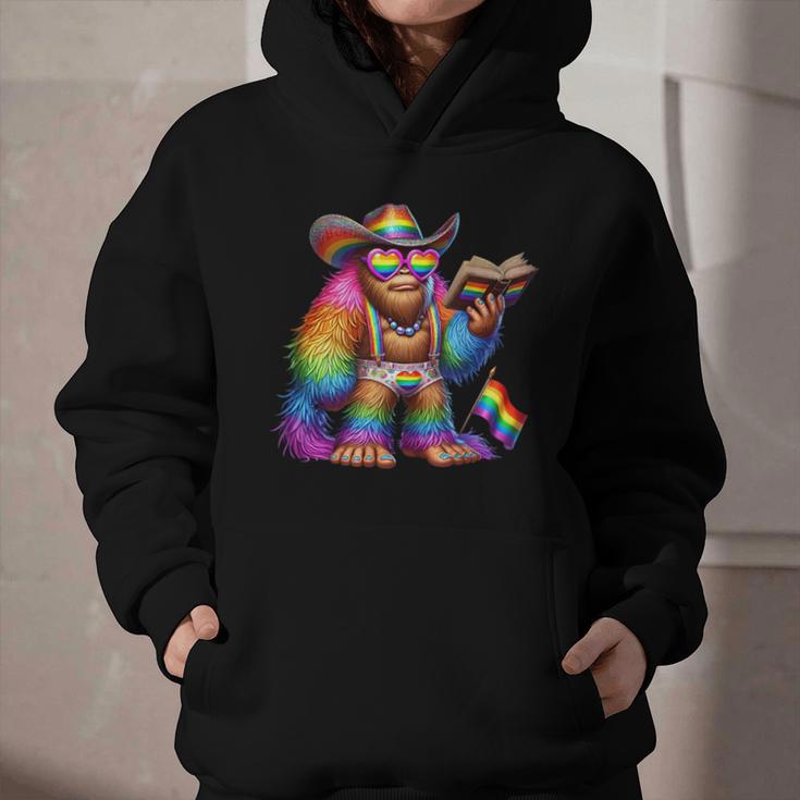 Rainbow Pride Bigfoot Reading Book With Heart Glasses Graphic Youth Hoodie