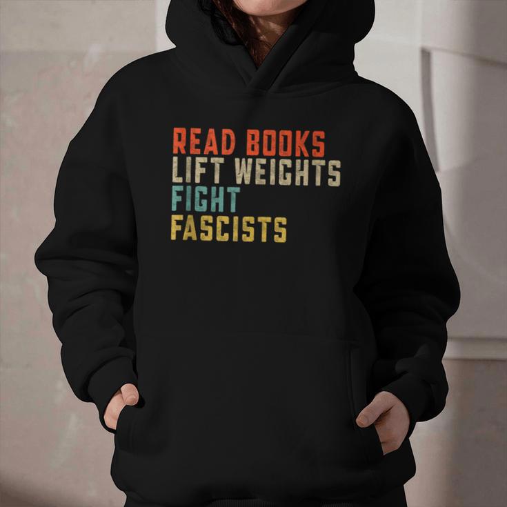 Read Books Lift Weights Fight Fascists Reading Graphic Youth Hoodie Read Books Lift Weights Fight Fascists Reading Graphic Youth Hoodie