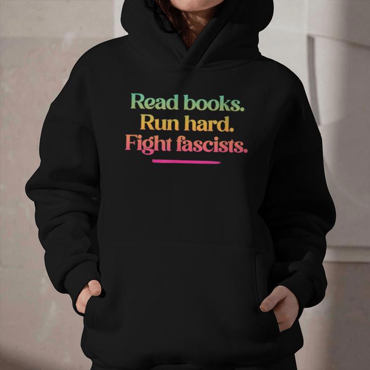 Read Books Run Hard Fight Fascists Graphic Youth Hoodie Read Books Run Hard Fight Fascists Graphic Youth Hoodie