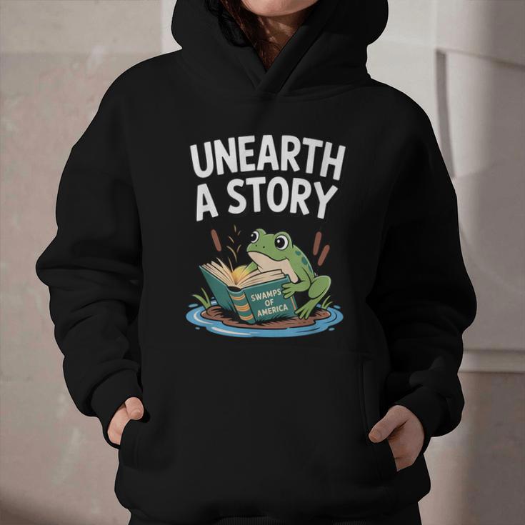 Unearth a Story Frog Reading a Book Summer 2026 Graphic Youth Hoodie Unearth a Story Frog Reading a Book Summer 2026 Graphic Youth Hoodie