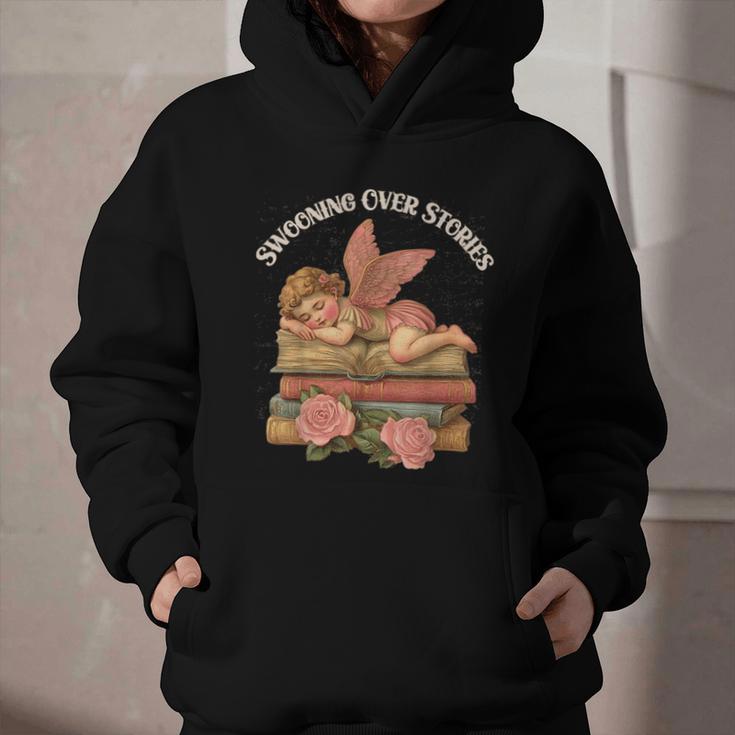 Valentine's Swooning Over Stories Cupid And Book Lover Tee Graphic Youth Hoodie