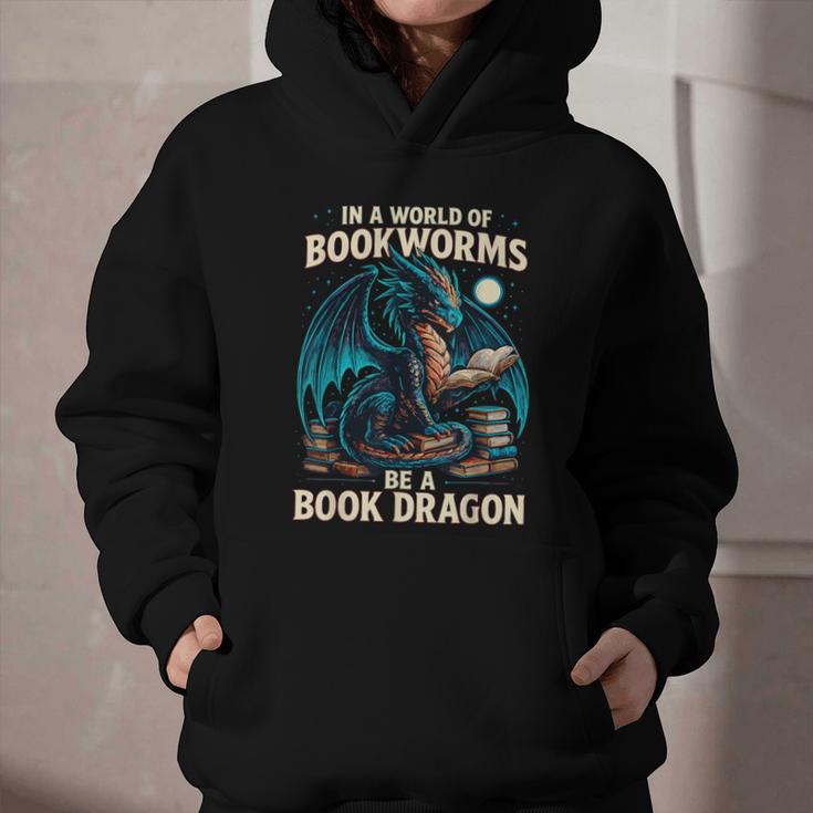 In a World Of Bookworms Be a Book Dragon Reading Graphic Youth Hoodie In a World Of Bookworms Be a Book Dragon Reading Graphic Youth Hoodie