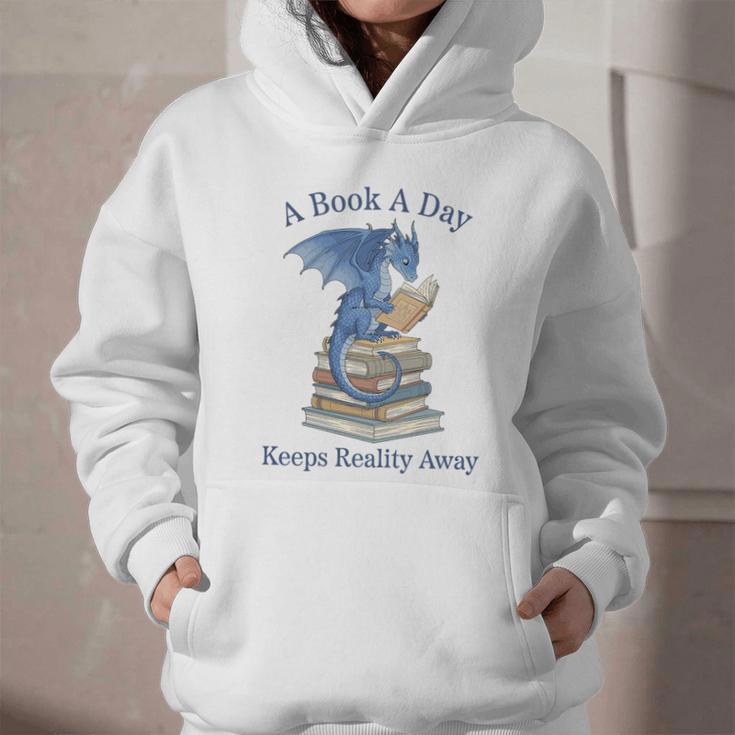 A Book A Day Keeps Reality Away Premium Tri-Blend Graphic Youth Hoodie