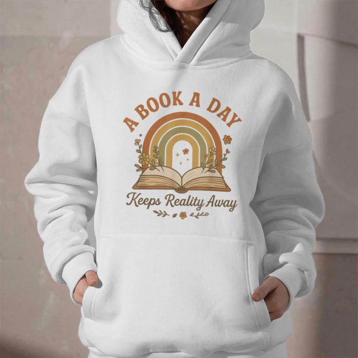 A Book A Day Keeps Reality Away Reading Graphic Youth Hoodie A Book A Day Keeps Reality Away Reading Graphic Youth Hoodie