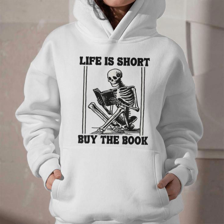 Life Is Short Buy The Book Skeleton Book Lover Reading Graphic Youth Hoodie Life Is Short Buy The Book Skeleton Book Lover Reading Graphic Youth Hoodie