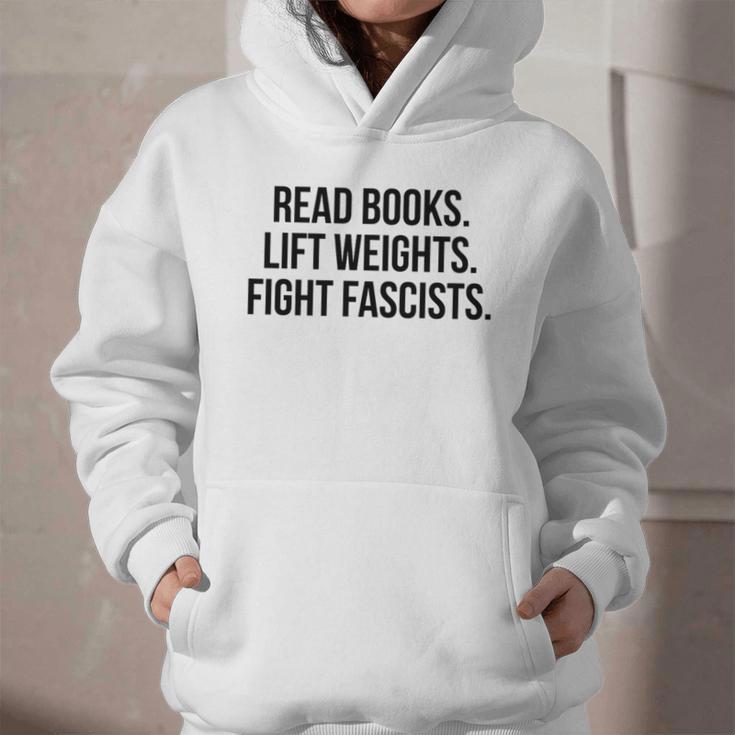 Read Books Lift Weights Fight Fascists Premium Tri-Blend Graphic Youth Hoodie Read Books Lift Weights Fight Fascists Premium Tri-Blend Graphic Youth Hoodie